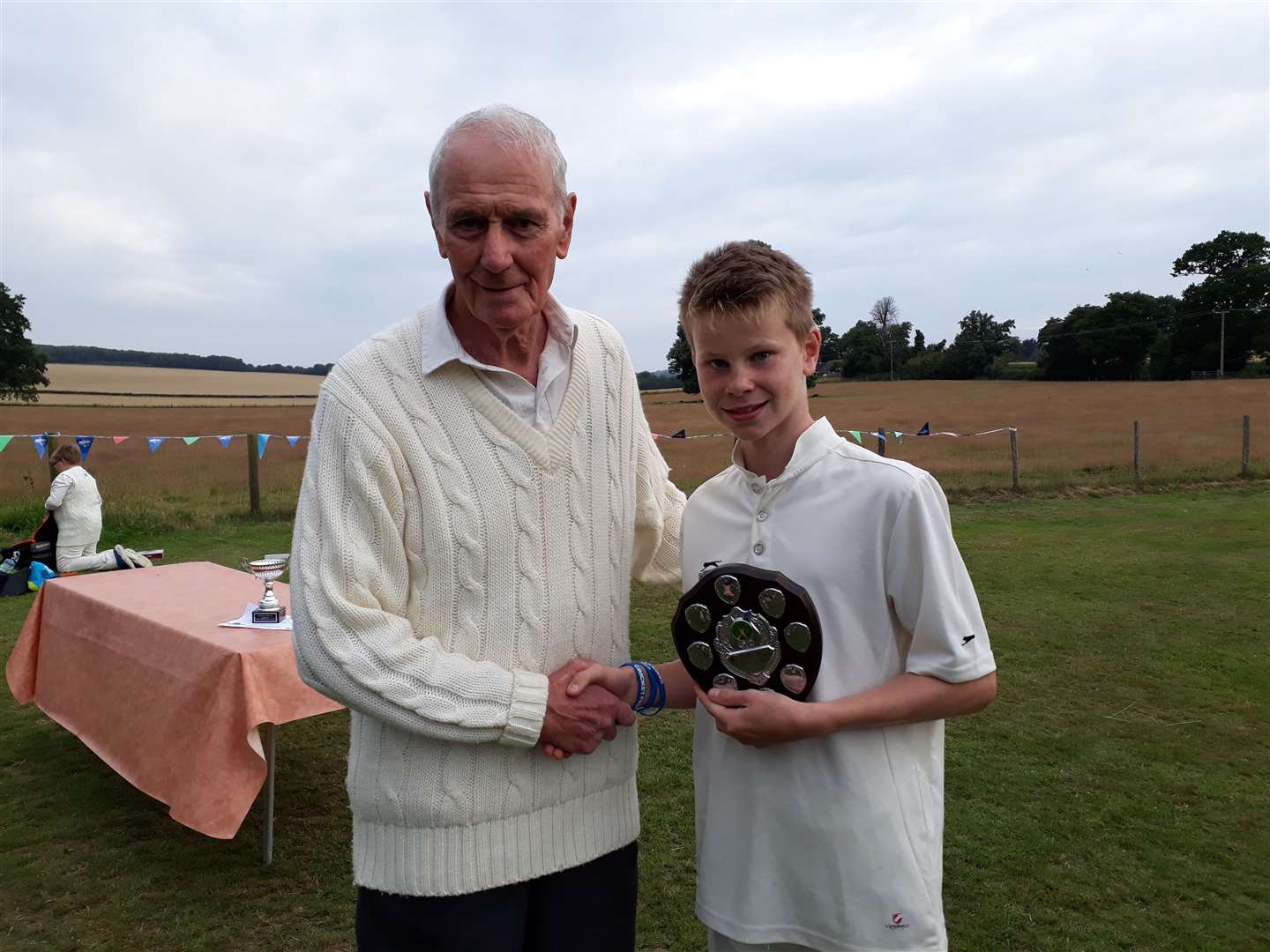 Street End Cricket Club junior prize-winner James Eddy receives his award from Alan Bensted in 2017
