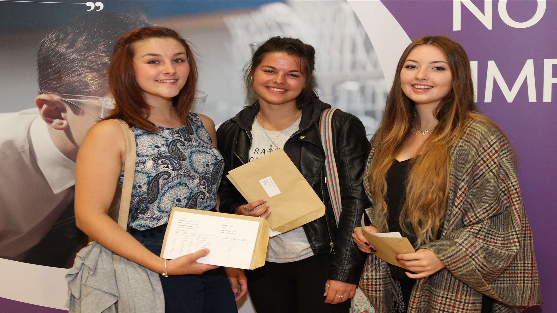 Holmesdale puplis Lucy Foster, Amy Medhurst and Sophie Dodd with their results