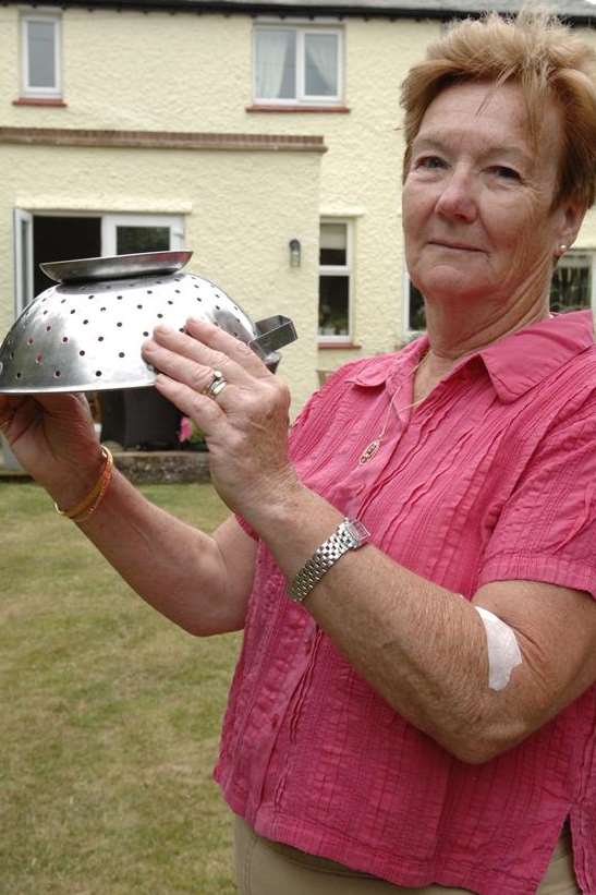 Dina Wilson with her weapon against seagulls - a colander