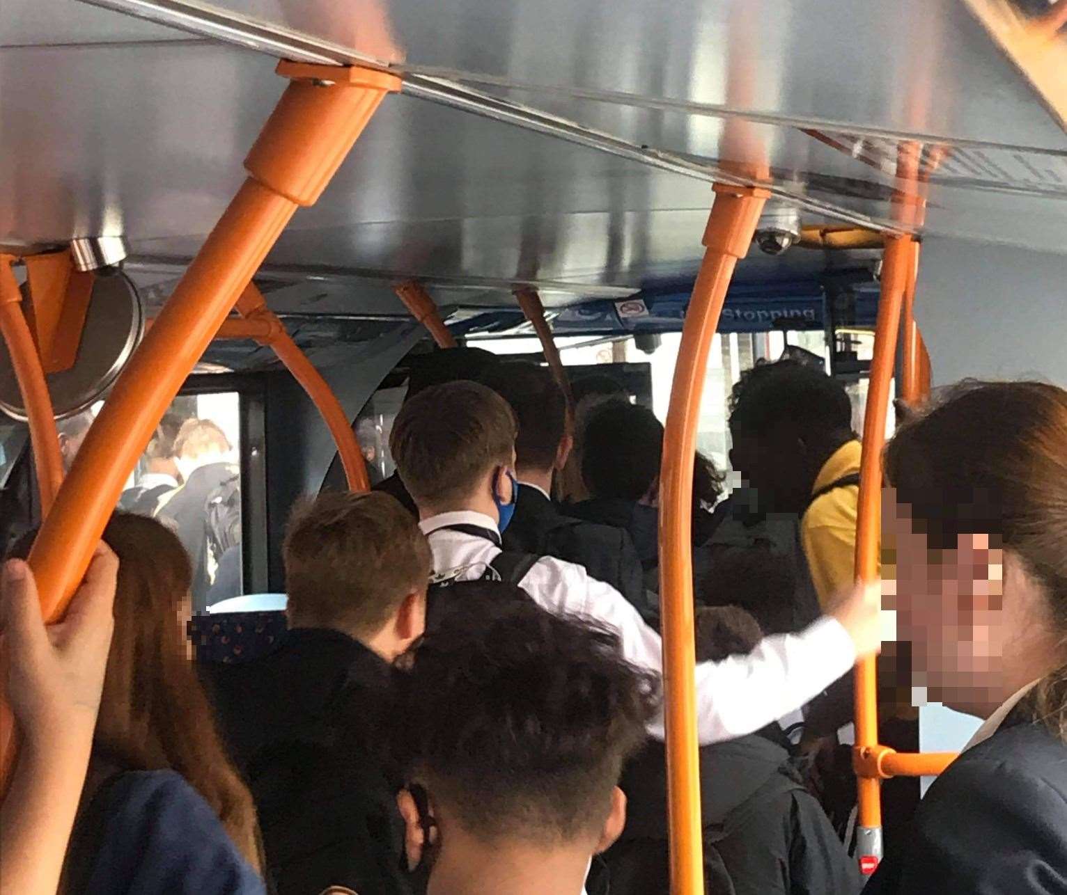 School pupils crowding to leave the bus in the afternoon