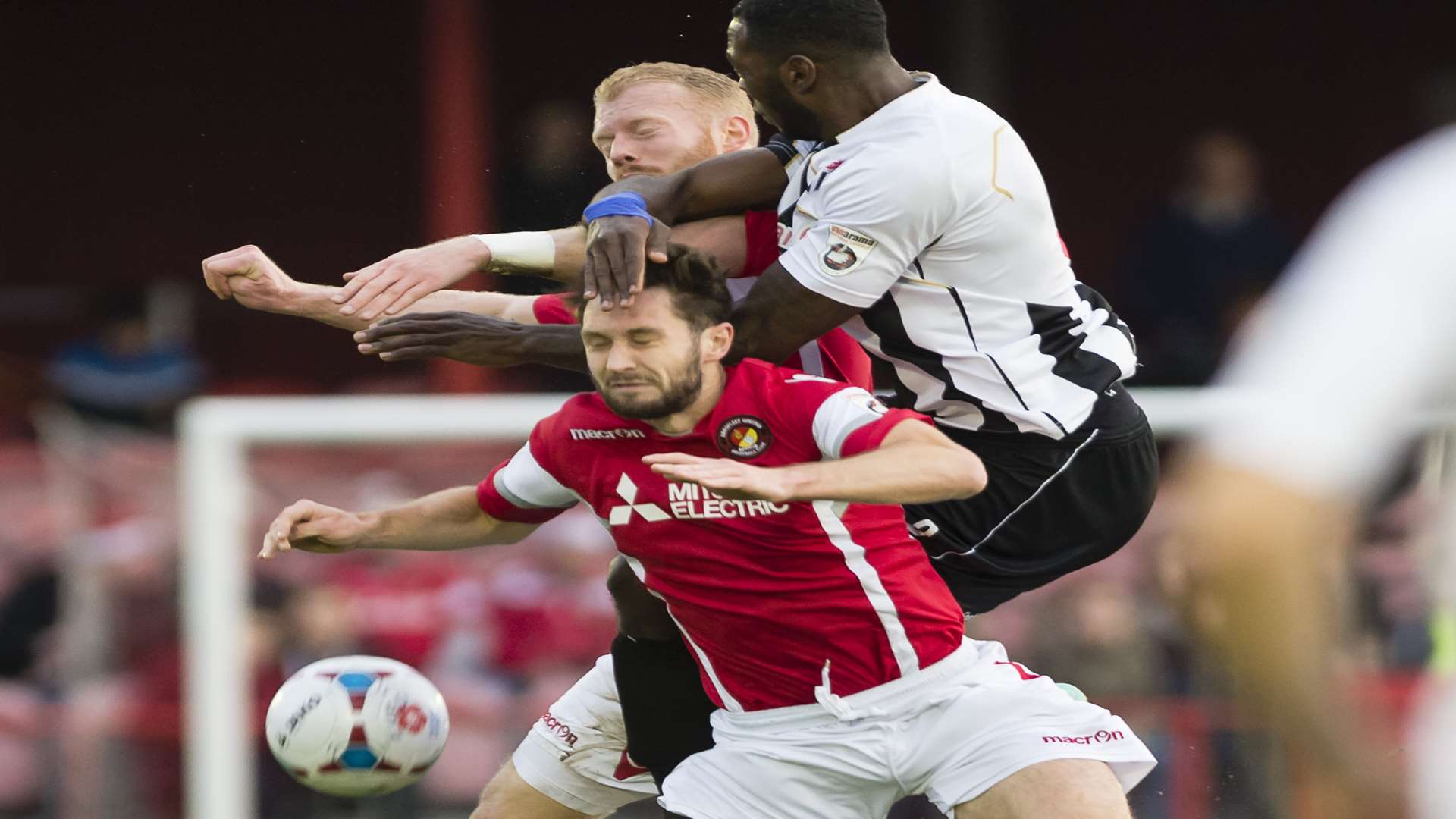 Ebbsfleet's Dean Rance feels the full force of this challenge against Bath City Picture: Andy Payton