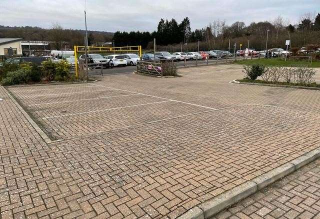 Looking across the empty Memorial Hall car park to the parking congestion outside the school