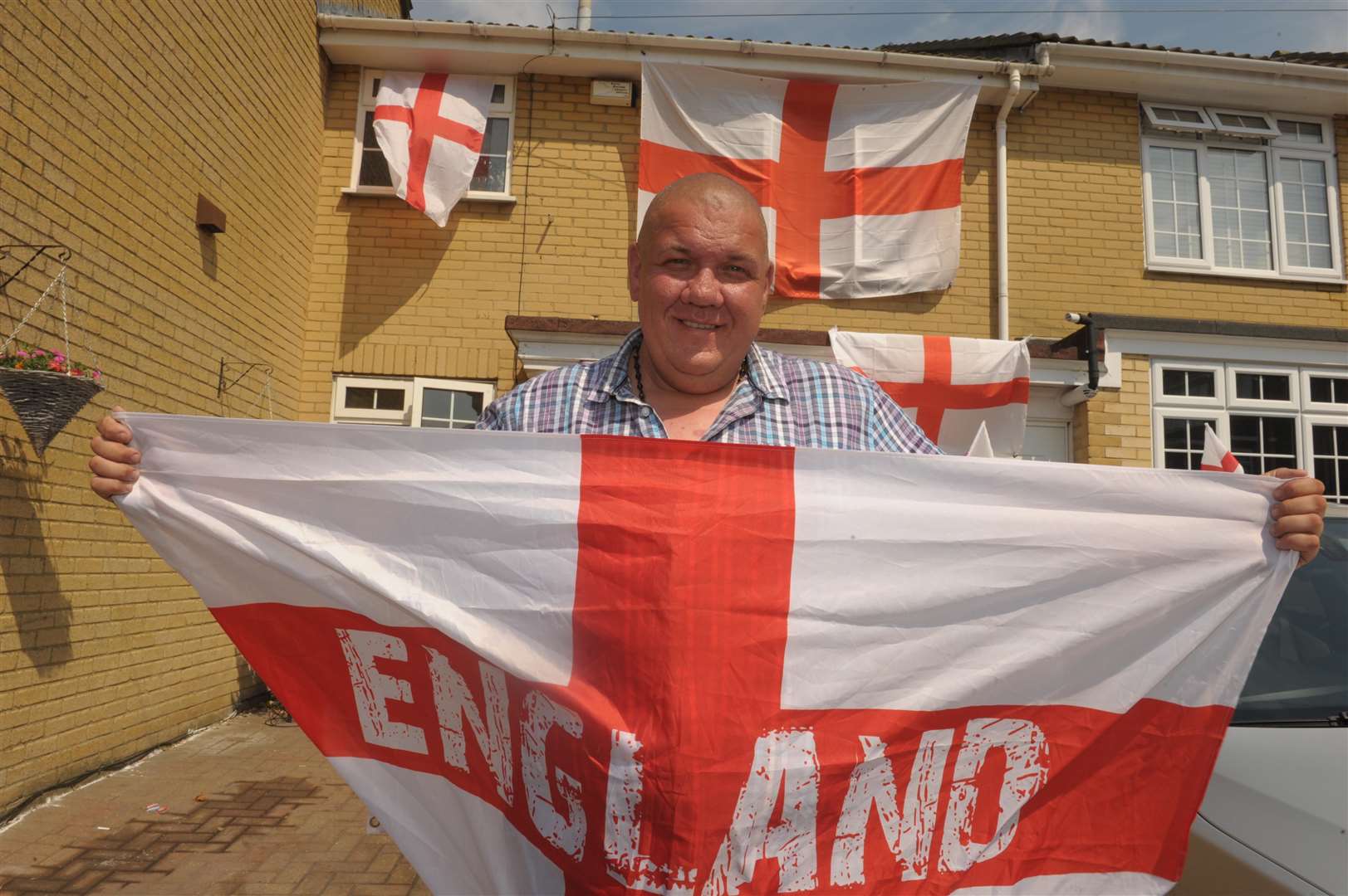 Despite his flag creating a Twitter storm last time, Dan is waving them proudly once again ahead of England's match tonight.Picture: Steve Crispe. (2924229)