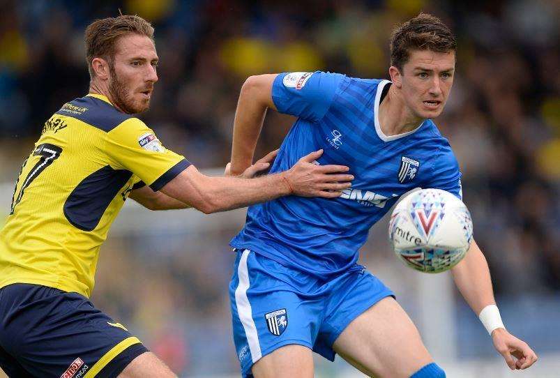 Gillingham defender Alex Lacey gets stuck in against Oxford last season Picture: Ady Kerry