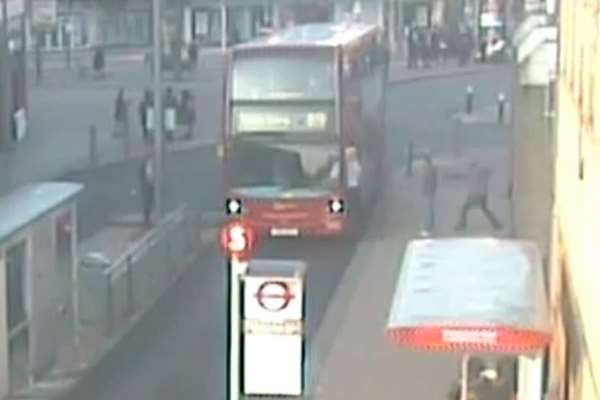 One of the passengers is seen hurling an object at the bus
