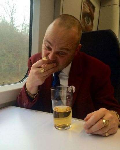 The Pub Landlord having breakfast on the train