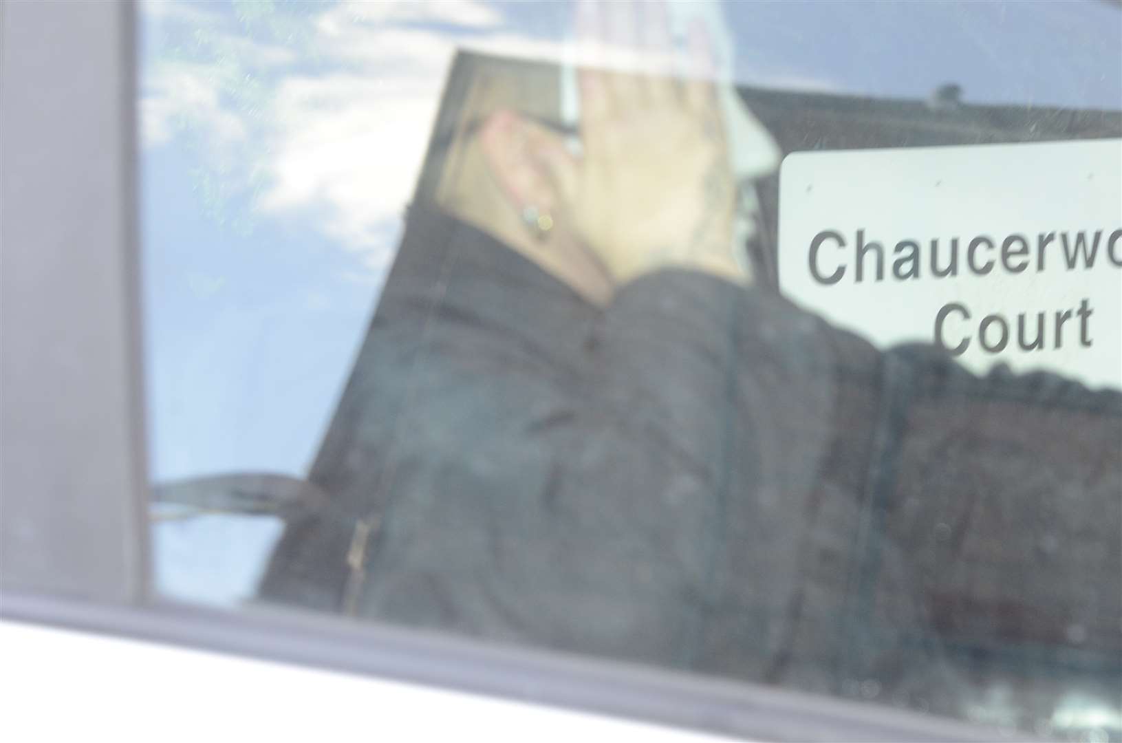 Heusser attempted to disguise herself with a Guy Fawkes mask as she was driven away from court. Picture: Chris Davey