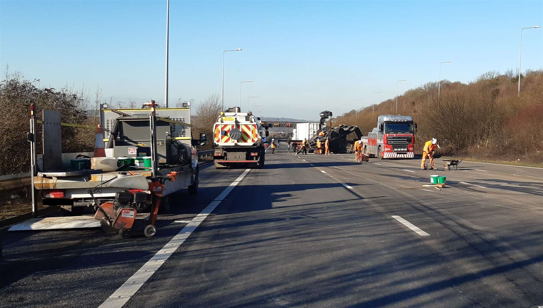 Clearance teams are removing parts of the wrecked trailer from the M2. Picture: Highways England (28524786)