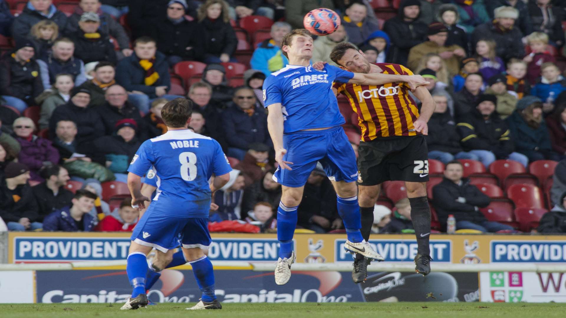 Tom Bradbrook goes up for a header with Bradford's Rory McArdle Picture: Andy Payton