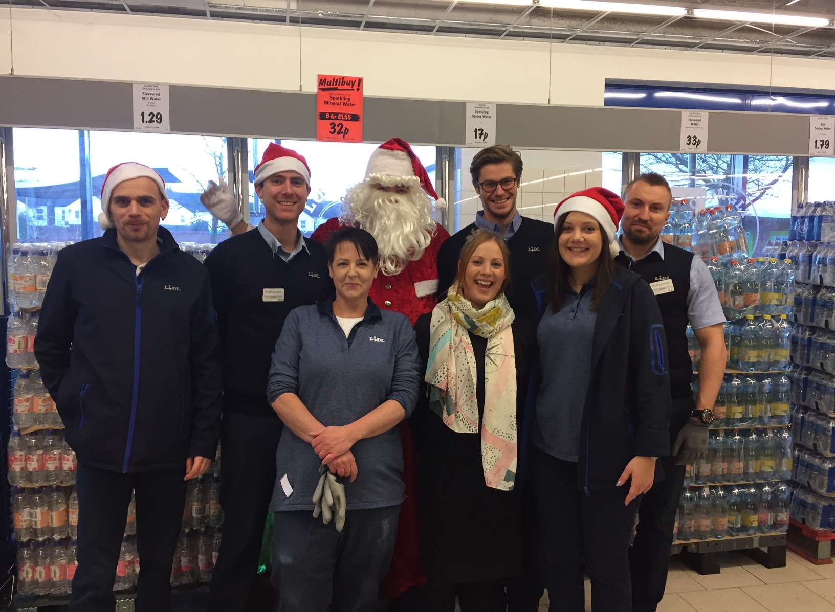 Staff celebrate the re-opening with Father Christmas