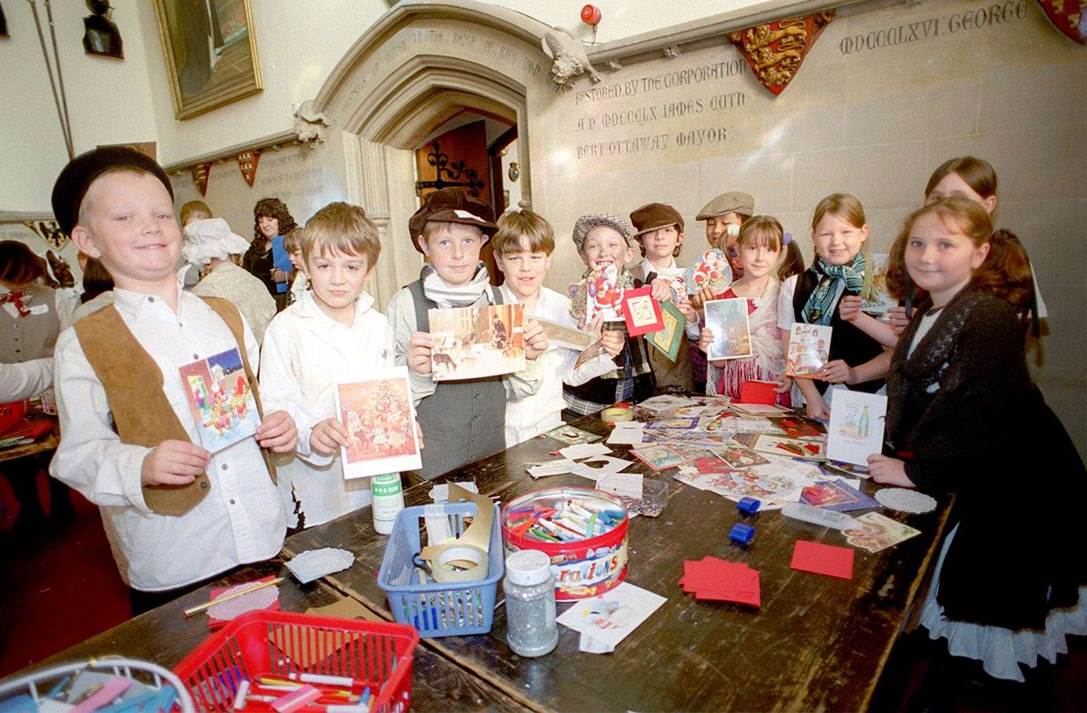 Christmas card makers in Victorian fancy dress from Cheriton Primary in 2001