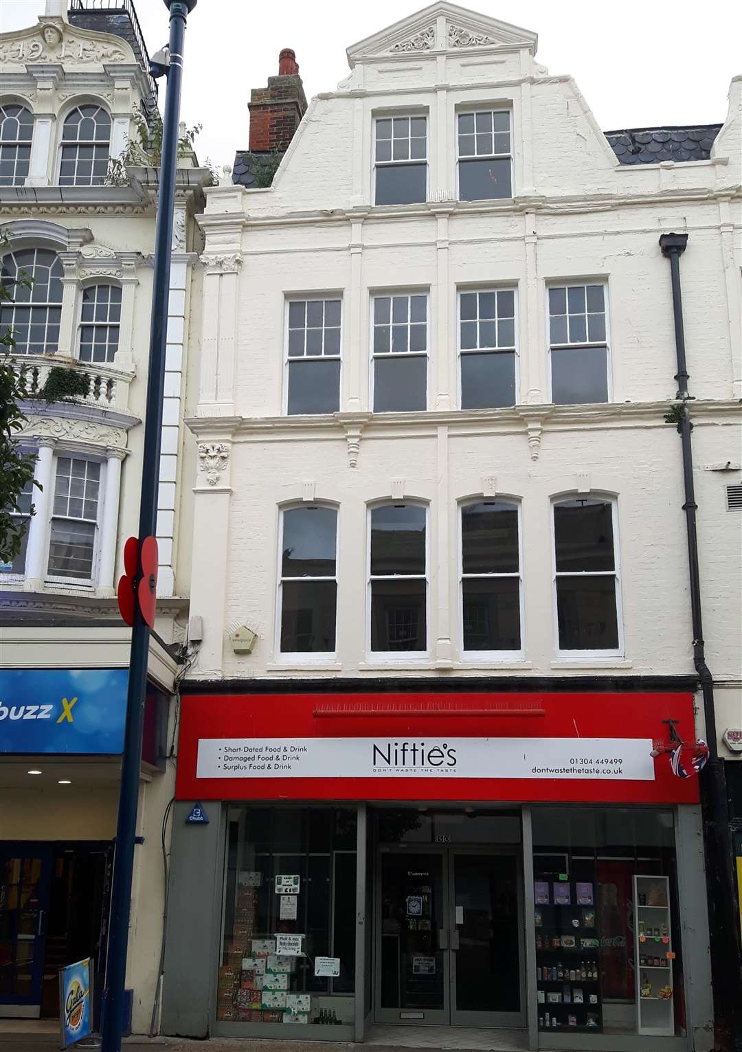 Looking better. One empty building has been spruced up and its shop front re-occupied, by Niftie's