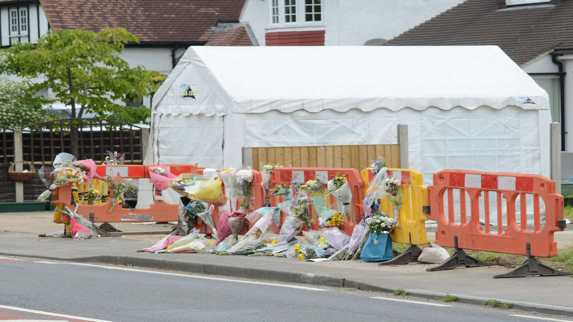 Floral tributes left to Jack Burmingham A2 at Newington near the junction of Playstool Road