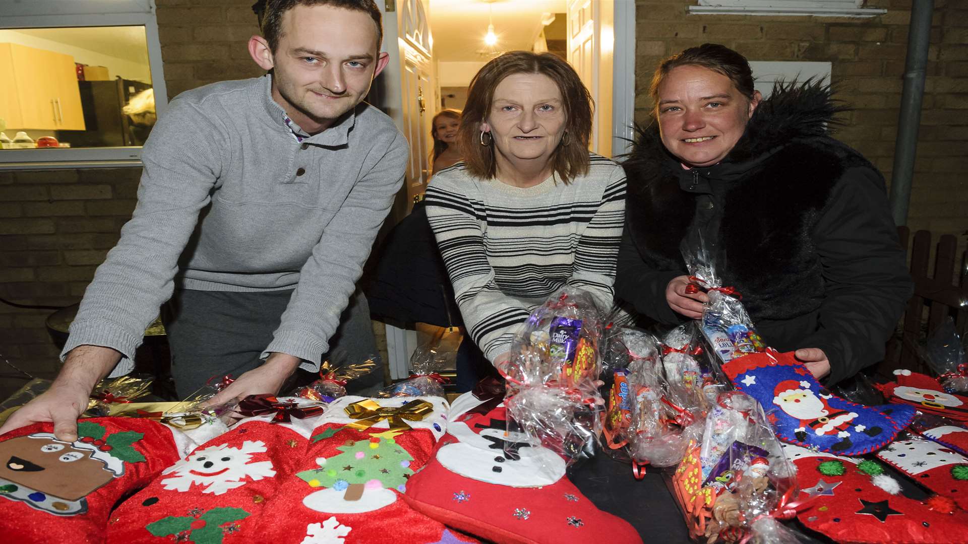 Gary Older, Veronica Older and Kelly Older, with Christmas trinkets for sale. The Light up a Life display at the home of the Older family, at Panters, Hextable, in aid of Help for Heroes and the Cystic Fibrosis Trust.