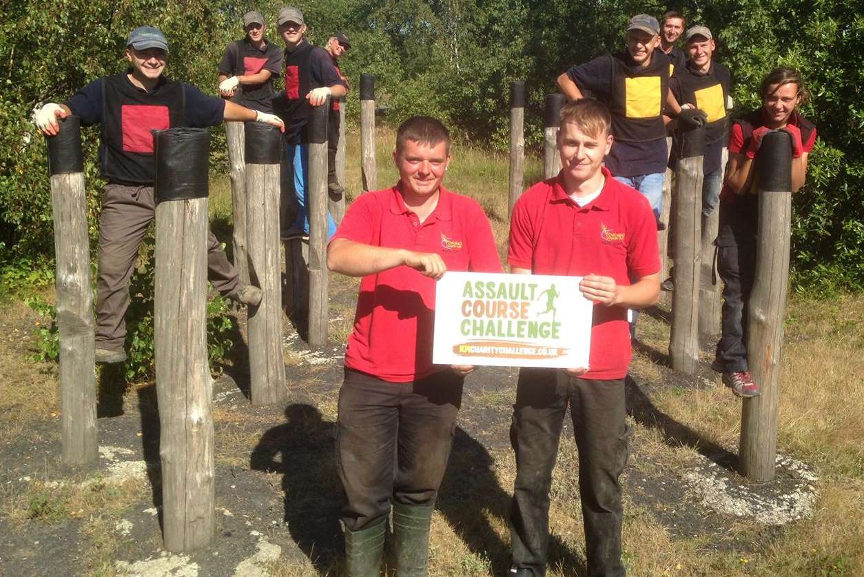 Assault course marshals Dean Meadows and Kieron Driver from Fowlmead Country Park with the team from Intercrop who are salad growers in Deal