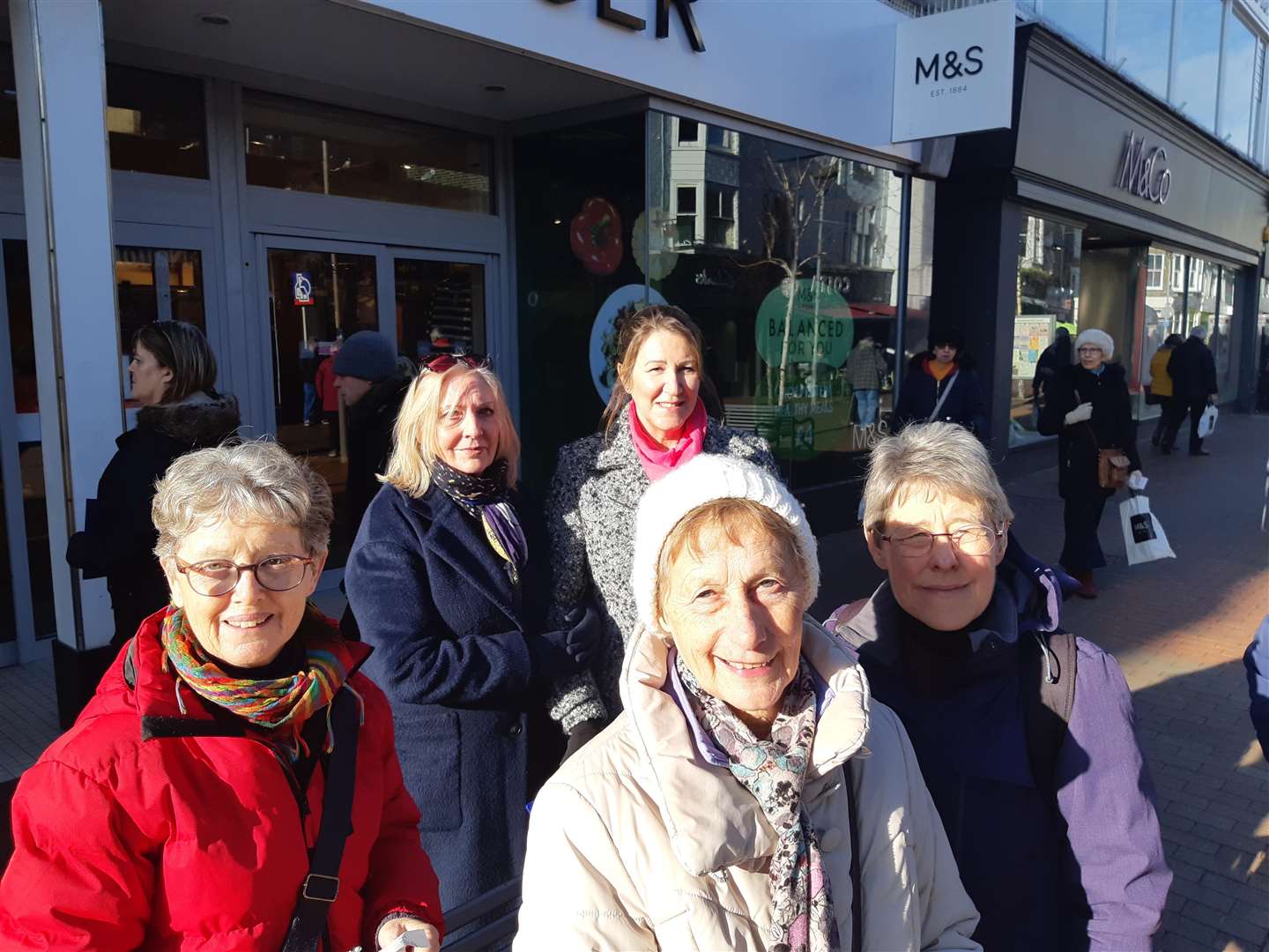 Mandy Austin, Sarah Jones, Sally MacDonald, Alma Longman, and Lorna Marchant sign a paper petition organised by Emma Ford of Tamarisk in the High Street
