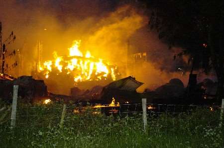 The fire had to be prevented spreading to nearby outbuildings. Picture: ANDY PAYTON