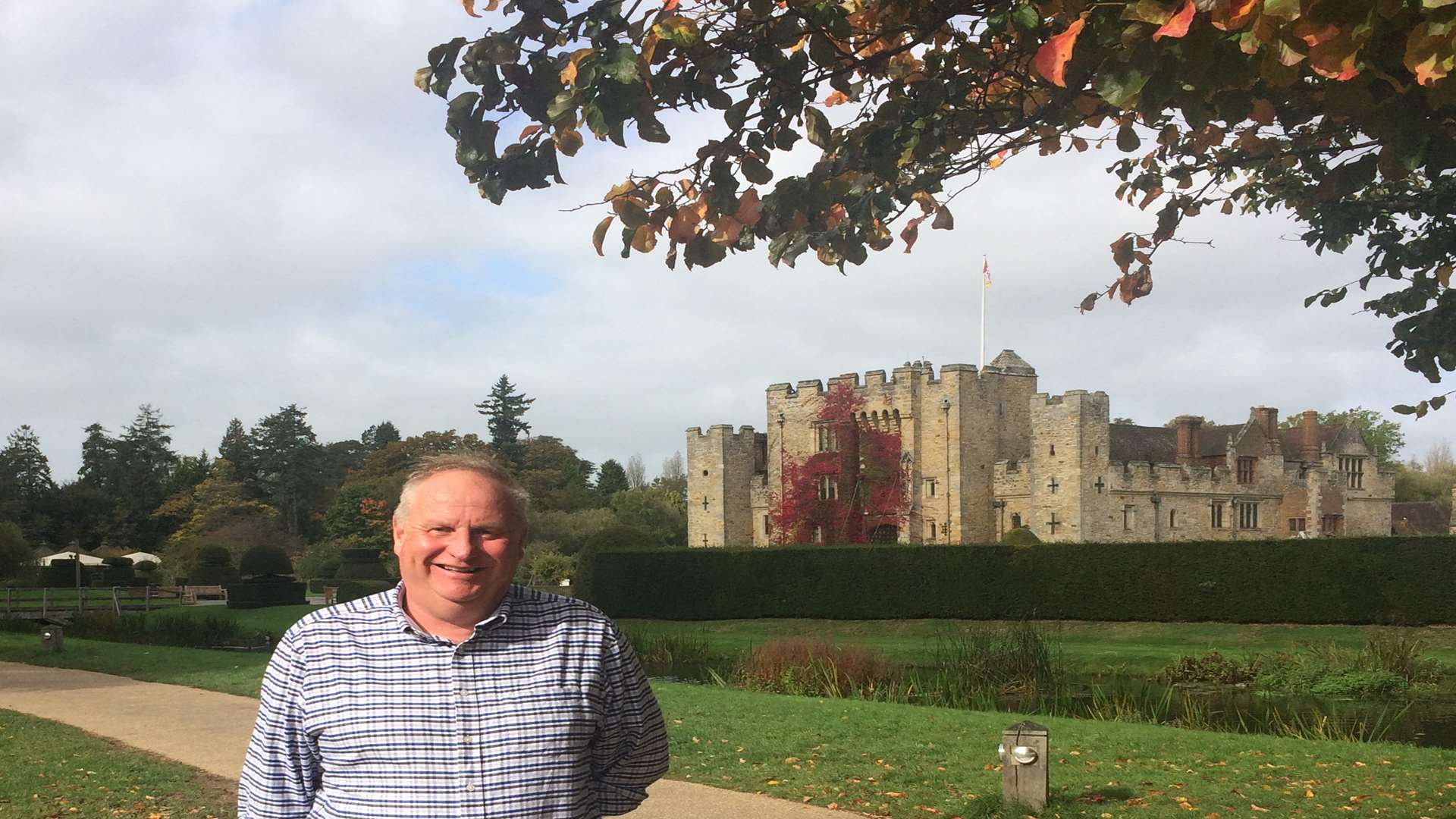 Neil in front of the castle that's covered in Boston ivy