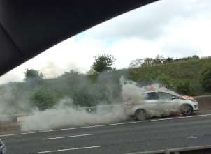 Smoke billowing from M20 car fire. Picture: Jenny Cosgrove.