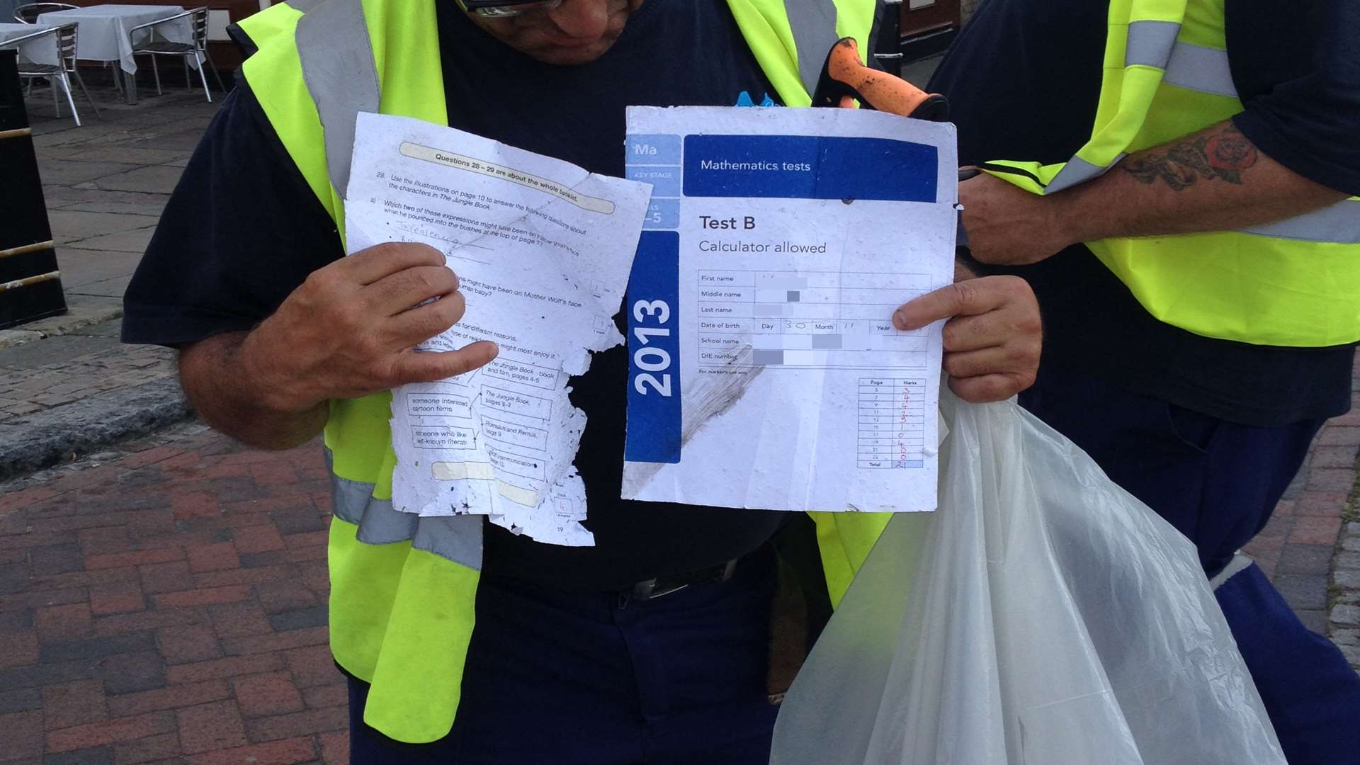 Cleaners were told to clear up what appears to be exam papers