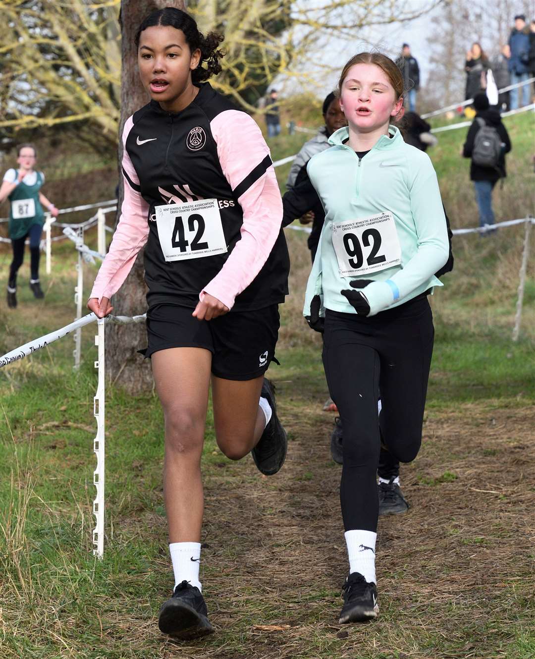 Year 7 Girls No.42 Lois Seery, of Canterbury & St Augustines, and No.92 Emma Duplock, of Swale, push on. Picture: Simon Hildrew