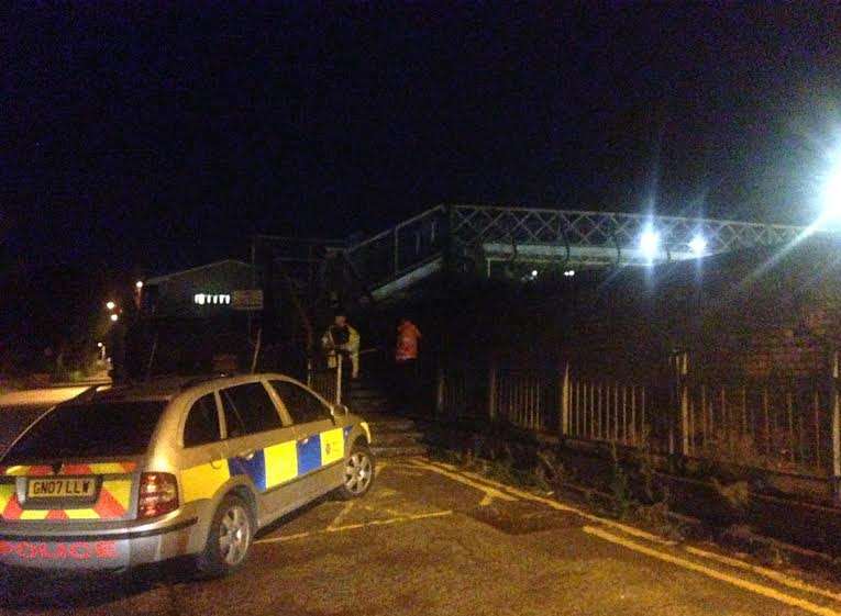 Police guarding the footbridge over the tracks. Picture: Bess Browning