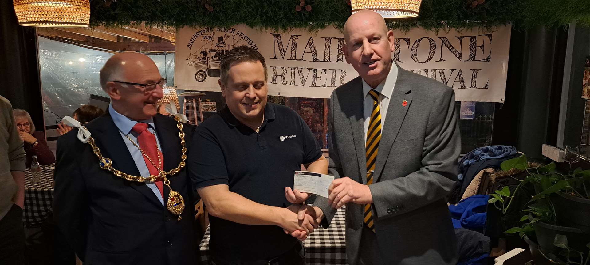 Paul Denyer from Alan Firmin Ltd presents a cheque for £10,000 sponsorship to Dave Naghi, the River Festival chairman, with the mayor Cllr Gordon Newton