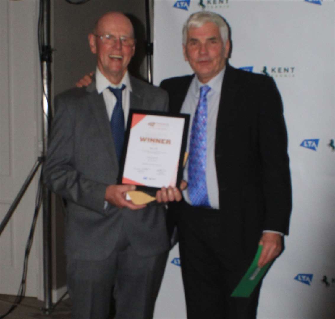 Graham Sutherland, left, of Wye LTC receives his Club-of-the-Year award (five or more courts) at the Kent Tennis awards ceremony from Tim Freeman of Trevor May Contractors