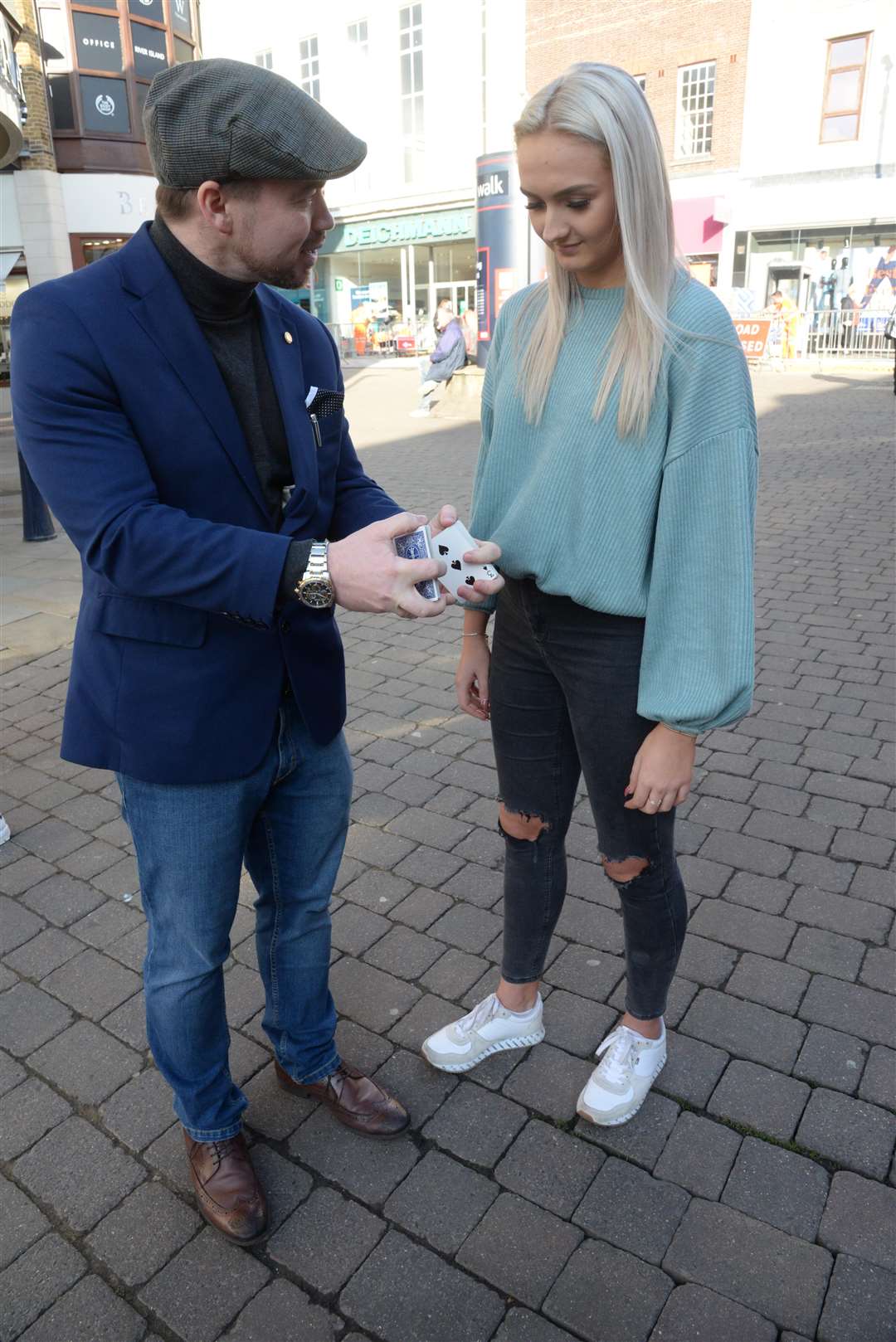 Magician Michael McIntyre performs one of his card tricks for Storm Miller in Maidstone on Friday. Picture: Chris Davey... (7387713)