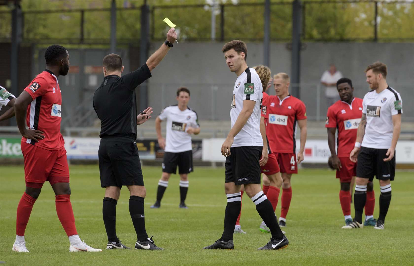 Charlie Sheringham is booked during Dartford's 2-2 draw with Eastbourne Picture: Andy Payton