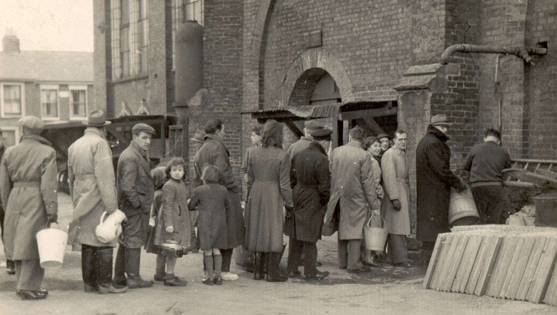 1953 floods. Queuing for fresh water at the pumping station in Trinity Road, Sheerness pic supplied by Roy Cunliffe, 8 Broom Road, St Helen's, Lancashire (61731005)