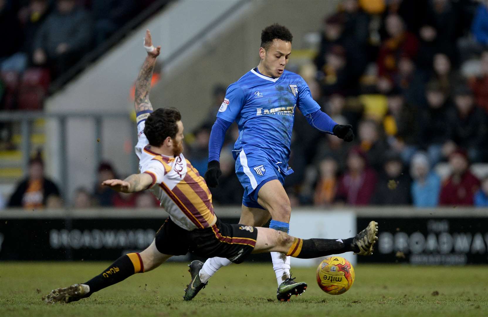 Elliott List is challenged by former Gills loanee Romain Vincelot at Valley Parade Picture: Ady Kerry