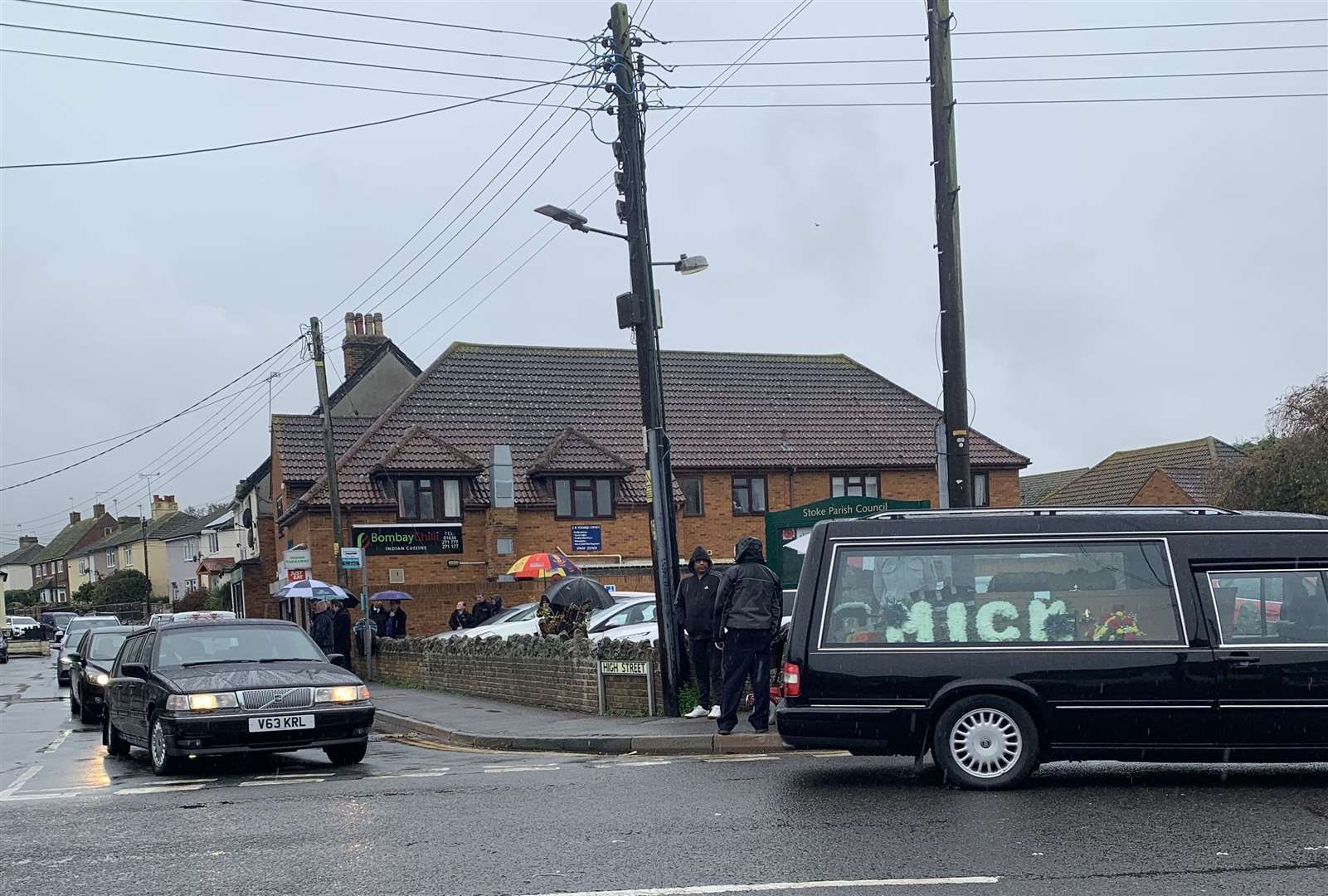 The hearse carrying Mick Pendergast's coffin passes his pub, the Nag's Head in Lower Stoke