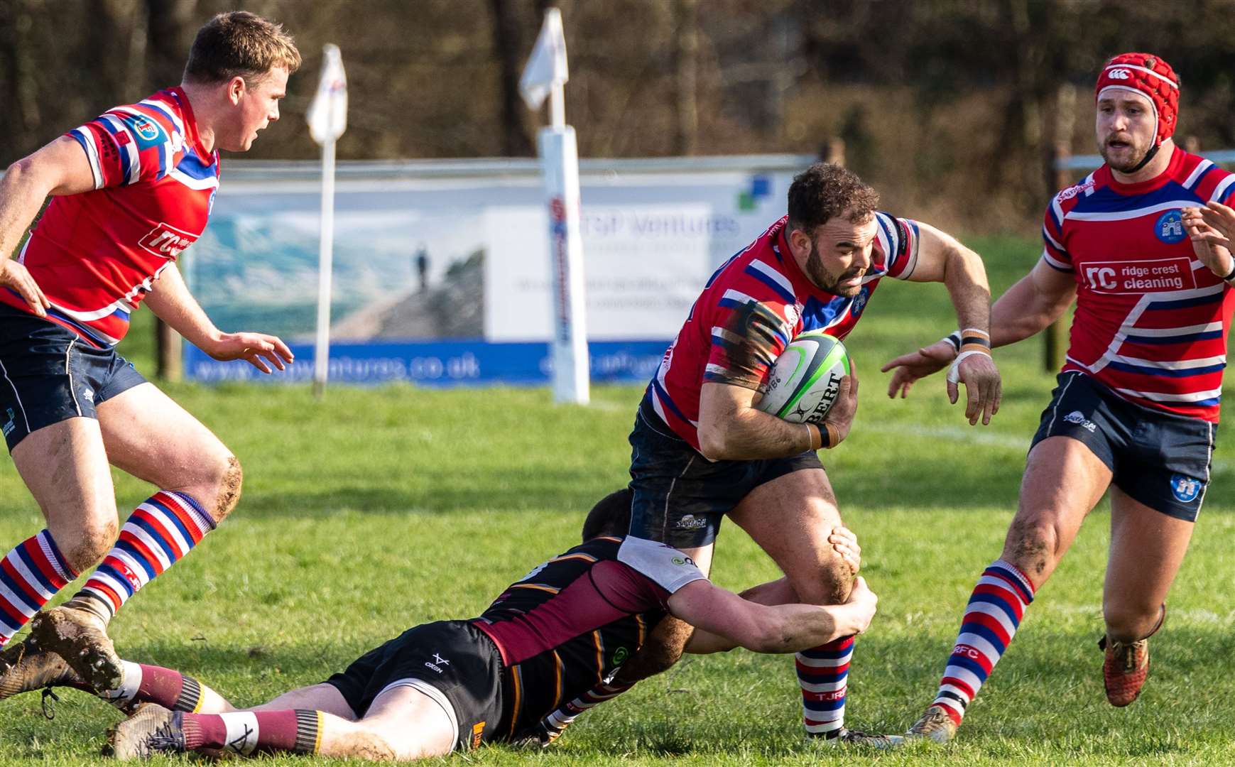 Tonbridge's Tom Nicoll is tackled by Caldy