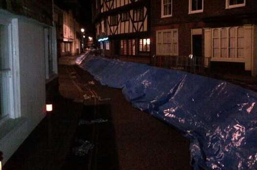 Temporary flood defence barriers are erected in Sandwich