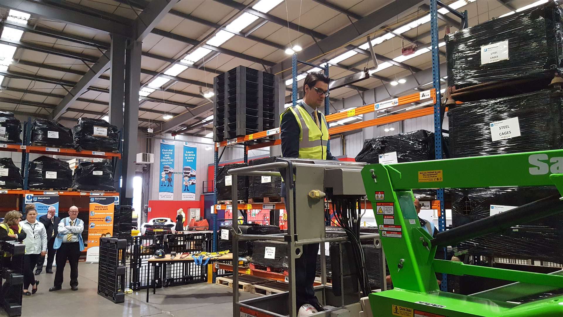 Chris Price learns to operate a cherry picker