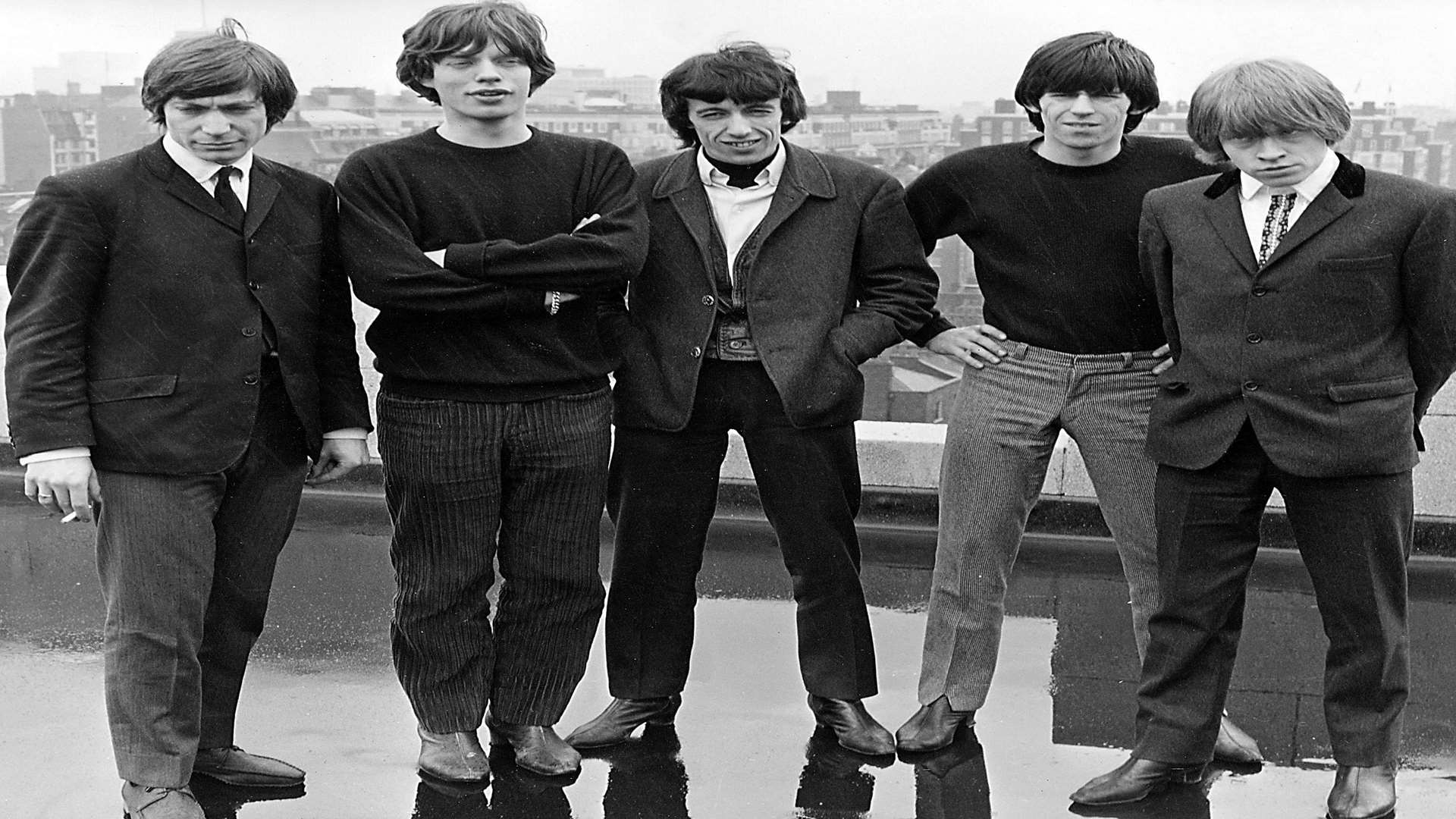 The Stones on the roof of Andrew Oldham's apartment block office at Stanhope Gate in London. June 1964.