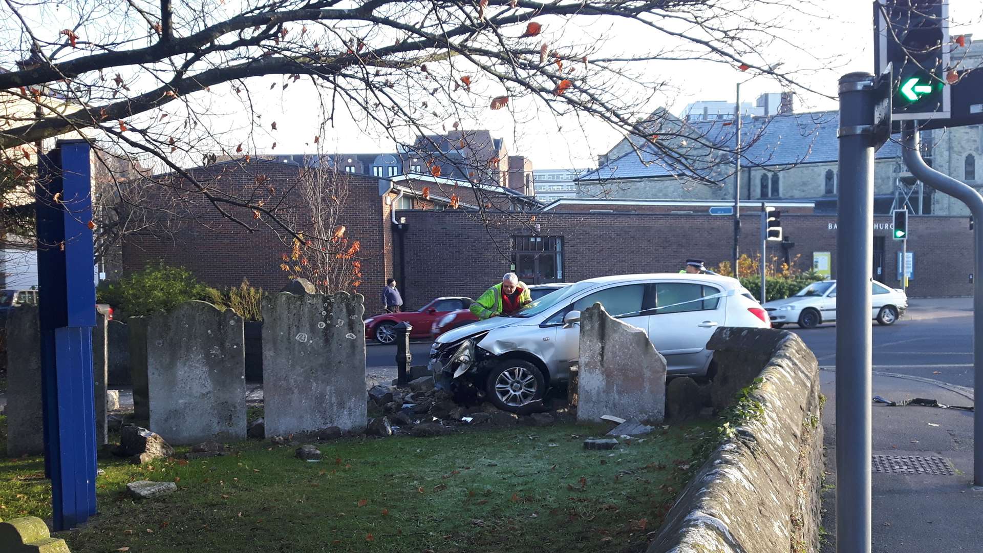 The scene of a crash at the graveyard at All Saints Church, Maidstone, where a car ploughed into the memorials