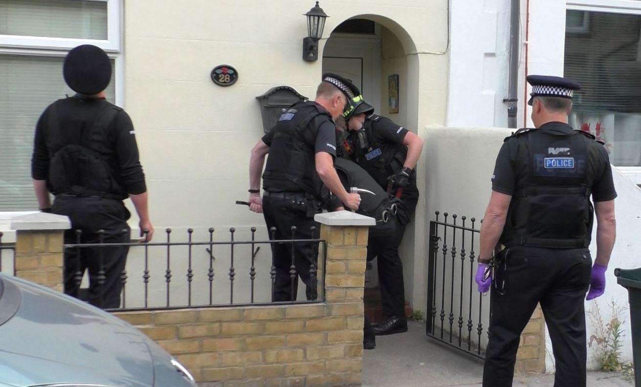 Police ramming the door down