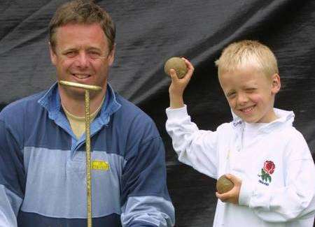 Charlie Booth aged five with his father Nicholas enjoying the coconut shy at the Museum of Kent Life in June 2002