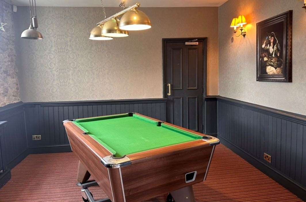 The pool table was popular with locals on opening night