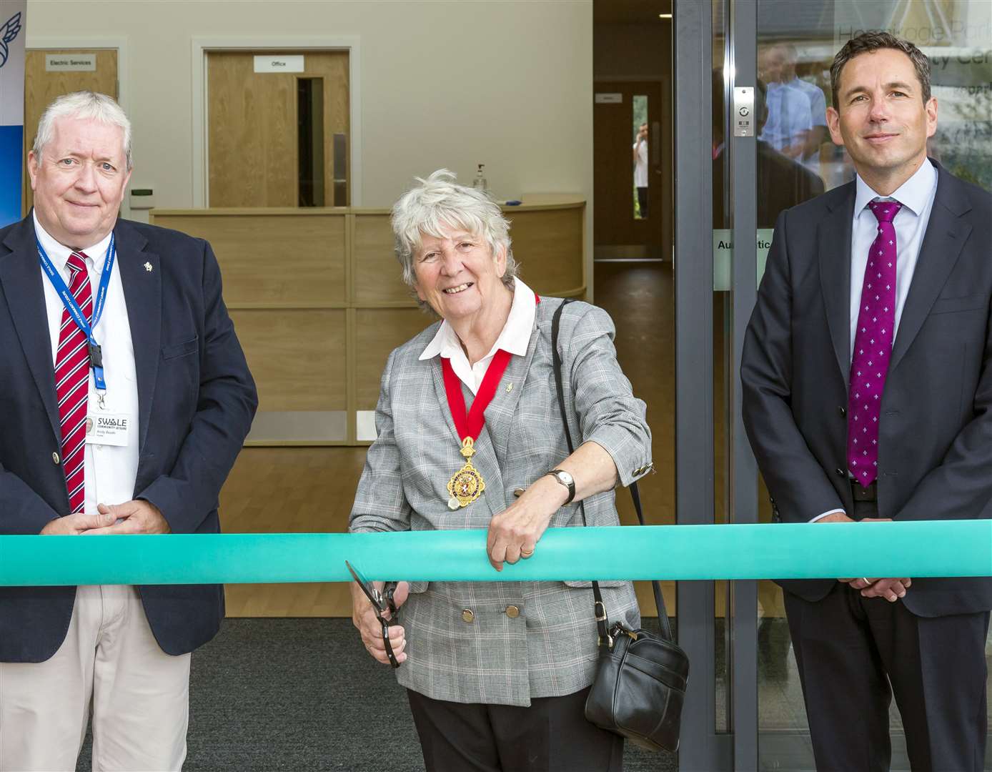 Cllr Ann Allen, the chairman of Kent County Council, cuts the tape to mark the opening of the Hermitage Park Community Centre in Maidstone