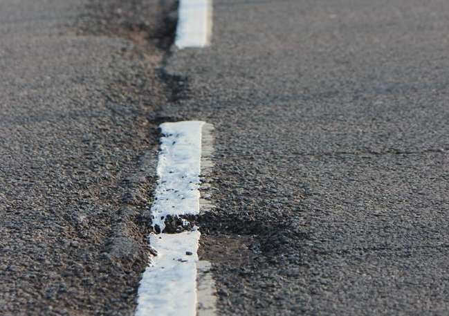 White lines were painted into potholes in Whiteway Road, Queenborough