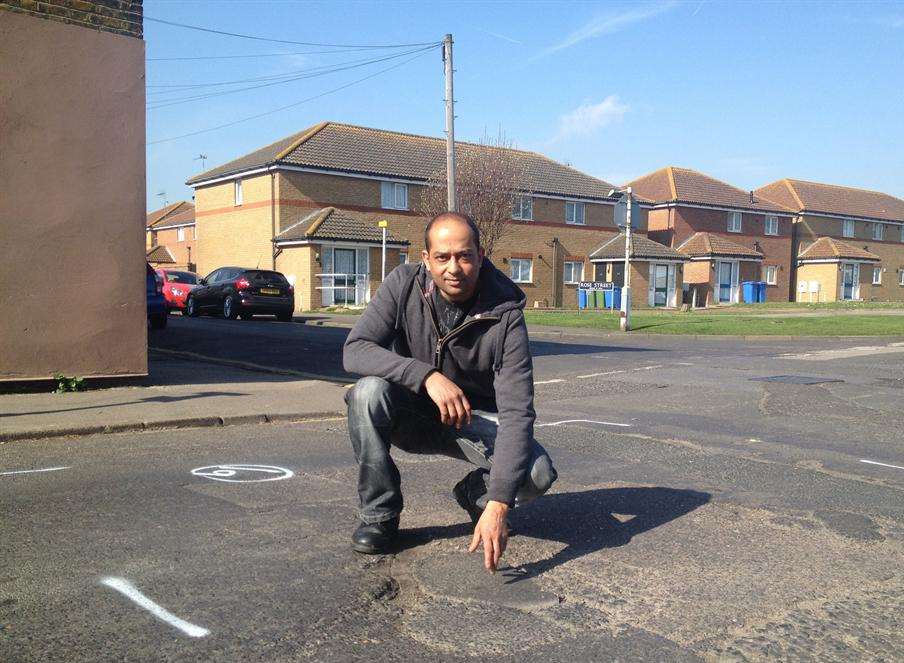 Shahid Ali shows the damaged surface in Granville Road, Sheerness