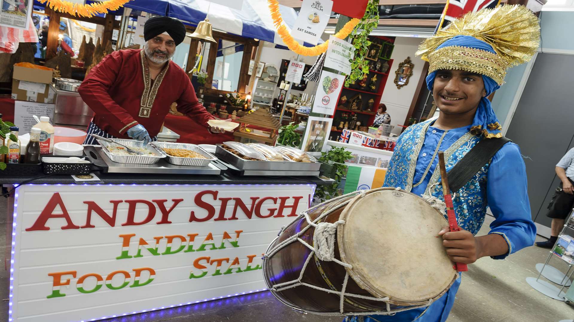 Andy Singh on his stall with drummer Suraj Sanger helping bring in the business