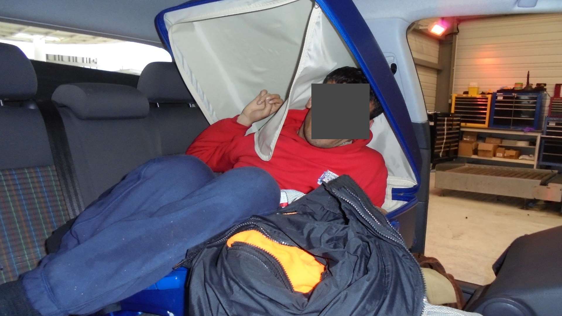 The Iraqi man was discovered trying to hide in the suitcase in the back of a car. Picture: Home Office
