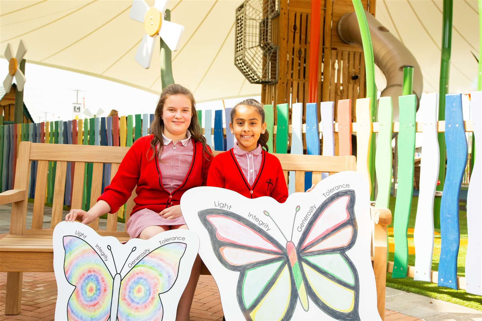The visit marked the first time students saw their winning butterfly designs come to life