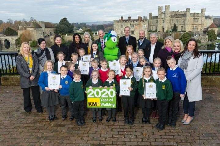 Walk-to-school and Busters Book Club challenge-day winners with representatives of organisations supporting the KM Charity Team's green-travel and literacy initiatives at Leeds Castle (22104850)
