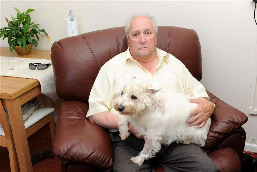 Roger Gilby with his dog Megan, who was attacked by four dogs.