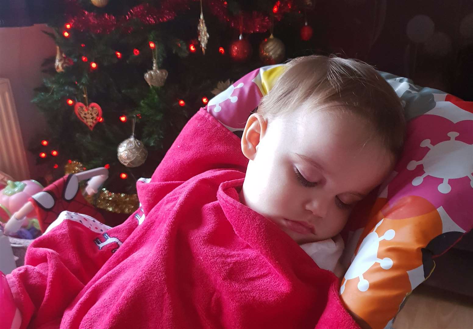 Chloe Ford having a sleep next to the Christmas tree the day before she died